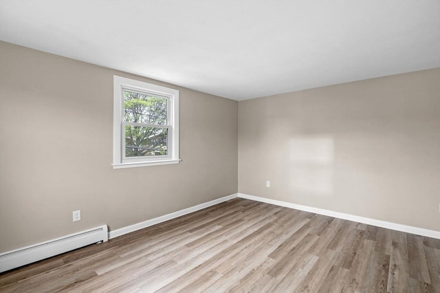 100 Magnolia Ave Unit 26, Lynn, MA 01904 - unfurnished room with a baseboard radiator, wood finished floors, and baseboards