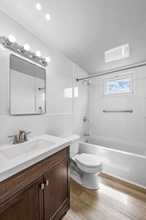 100 Magnolia Ave Unit 26, Lynn, MA 01904 - full bath with wood finished floors, toilet, bathtub / shower combination, and vanity
