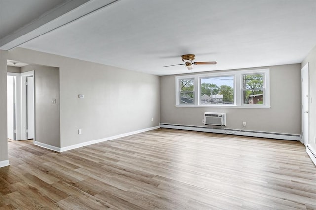 100 Magnolia Ave Unit 26, Lynn, MA 01904 - empty room with a ceiling fan, light wood-style floors, baseboards, a wall mounted air conditioner, and a baseboard radiator