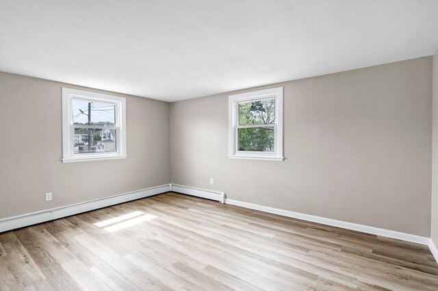 100 Magnolia Ave Unit 26, Lynn, MA 01904 - spare room featuring wood finished floors, plenty of natural light, and baseboards