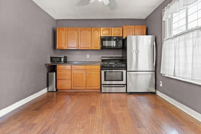 57 Bessom St, Lynn, MA 01902 - kitchen with stainless steel appliances, hardwood / wood-style floors, and ceiling fan
