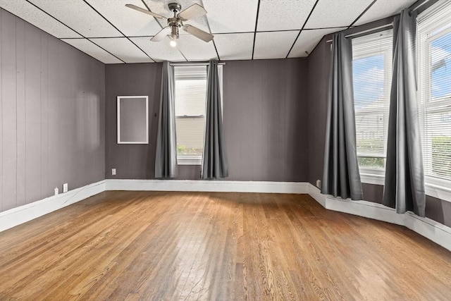 57 Bessom St, Lynn, MA 01902 - spare room featuring wood finished floors, ceiling fan, a paneled ceiling, and healthy amount of natural light