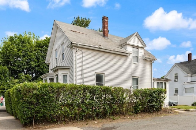 57 Bessom St, Lynn, MA 01902 - view of property exterior with a chimney