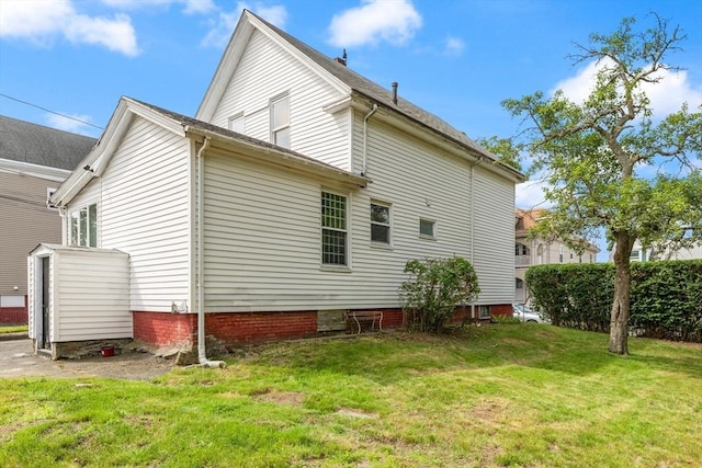 57 Bessom St, Lynn, MA 01902 - view of side of property featuring a lawn