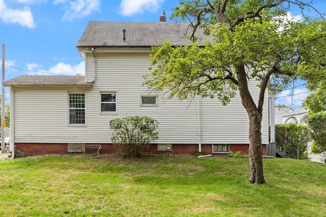 57 Bessom St, Lynn, MA 01902 - view of side of home featuring a yard