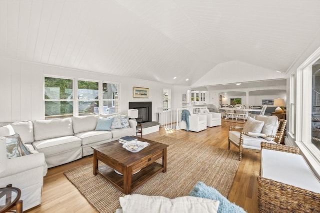 5 Kidd Way, Orleans, MA 02653 - living room featuring light wood-style floors, lofted ceiling, and a fireplace with raised hearth
