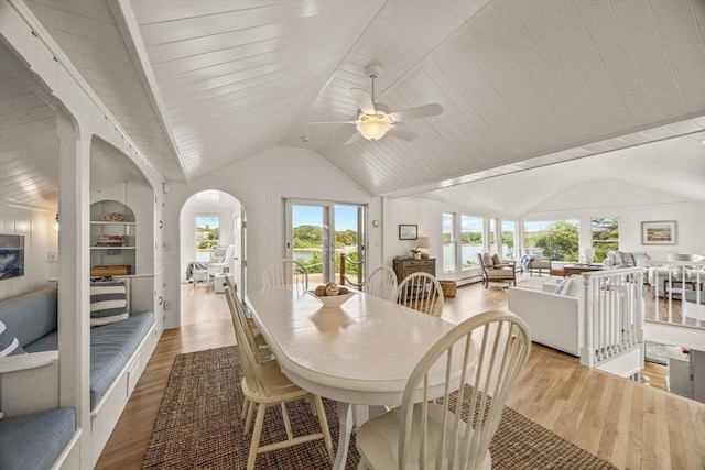 5 Kidd Way, Orleans, MA 02653 - dining space featuring vaulted ceiling, wood finished floors, ceiling fan, arched walkways, and a water view