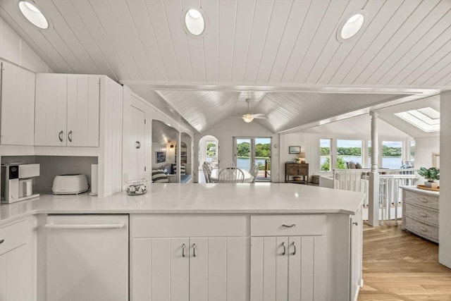 5 Kidd Way, Orleans, MA 02653 - kitchen featuring dishwasher, a peninsula, light wood-type flooring, a water view, and white cabinetry