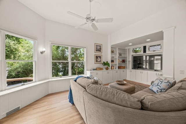 5 Kidd Way, Orleans, MA 02653 - living area featuring healthy amount of natural light, light wood-style floors, a ceiling fan, and a wainscoted wall