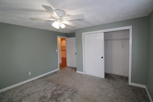 unfurnished bedroom featuring carpet flooring, a closet, and baseboards