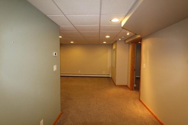 hall featuring baseboard heating, carpet flooring, baseboards, and recessed lighting