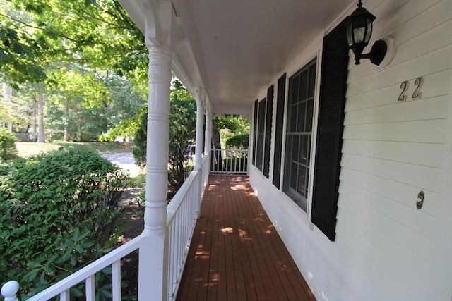 wooden terrace featuring a porch