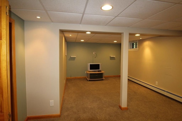 finished basement featuring recessed lighting, a drop ceiling, carpet, and baseboard heating