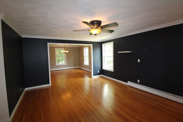 unfurnished room featuring ceiling fan with notable chandelier, ornamental molding, a baseboard heating unit, and hardwood / wood-style floors