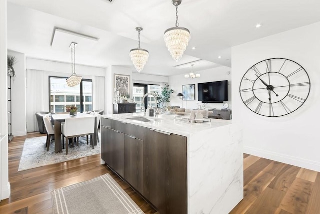 300 Blvd 3I, Boston, MA 02210 - kitchen featuring a sink, a chandelier, light countertops, open floor plan, and dark wood finished floors