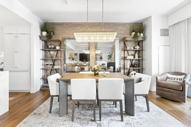 300 Blvd 3I, Boston, MA 02210 - dining room featuring a chandelier and wood finished floors