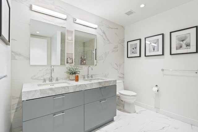 300 Blvd 3I, Boston, MA 02210 - full bathroom featuring double vanity, toilet, marble finish floors, and baseboards