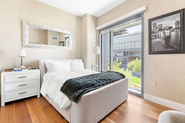 300 Blvd 3I, Boston, MA 02210 - bedroom with access to exterior, wood finished floors, and baseboards