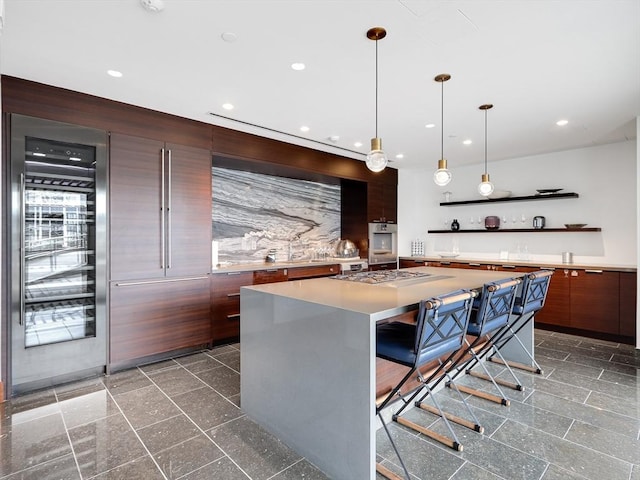 300 Blvd 3I, Boston, MA 02210 - kitchen featuring modern cabinets, open shelves, a kitchen island, a breakfast bar, and recessed lighting