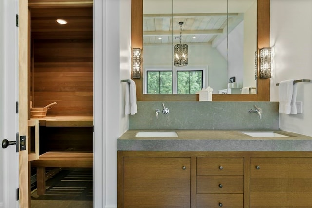 bathroom featuring vanity, wooden ceiling, lofted ceiling, and a chandelier