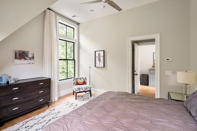 bedroom with ceiling fan and light wood-type flooring