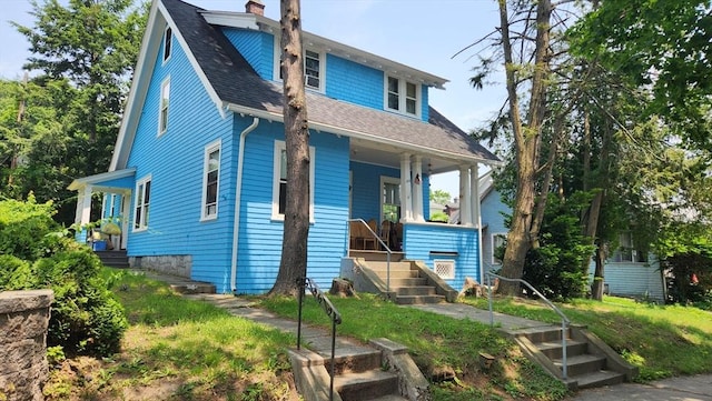 132 Institute Rd, Worcester, MA 01602 - view of front facade with a shingled roof, a porch, and a chimney
