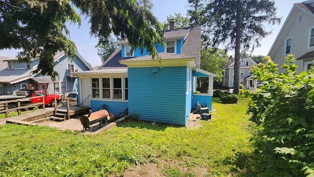 132 Institute Rd, Worcester, MA 01602 - back of house with a yard, a wooden deck, and roof with shingles