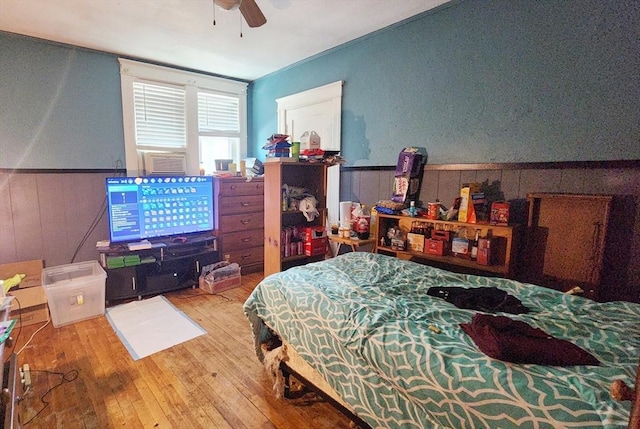 132 Institute Rd, Worcester, MA 01602 - bedroom featuring a wainscoted wall, wood-type flooring, wooden walls, and cooling unit