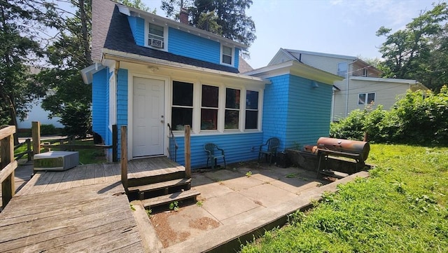 132 Institute Rd, Worcester, MA 01602 - back of property featuring a deck, a shingled roof, and a chimney