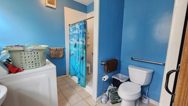132 Institute Rd, Worcester, MA 01602 - bathroom with washer / dryer, a stall shower, and tile patterned floors