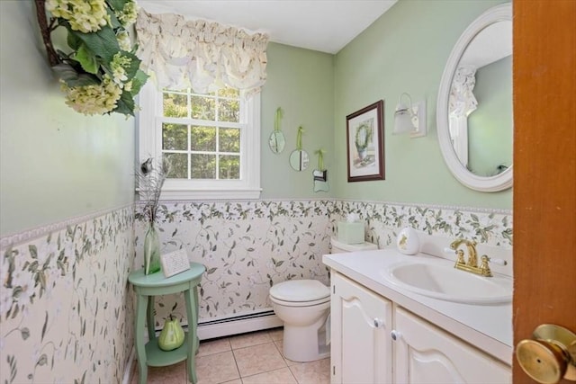 bathroom featuring wainscoting, tile patterned floors, toilet, vanity, and baseboard heating