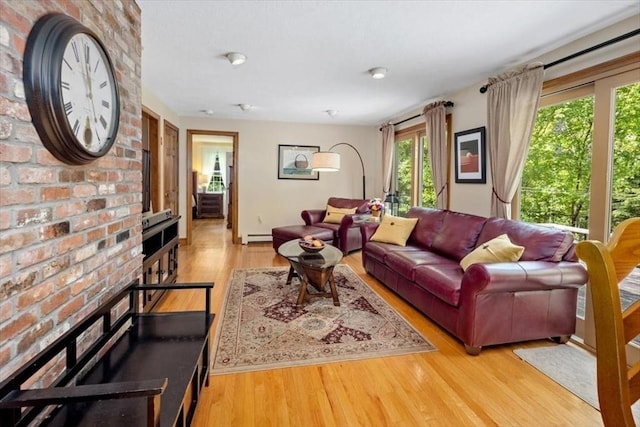 living room featuring baseboard heating and wood finished floors