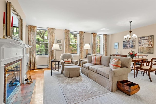 5 Myrtle St Unit 3, Boston, MA 02114 - living area with baseboard heating, a chandelier, and a fireplace with flush hearth