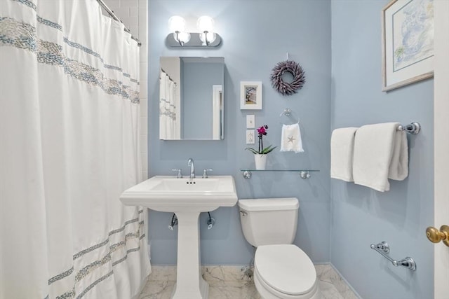5 Myrtle St Unit 3, Boston, MA 02114 - bathroom featuring toilet, marble look tile flooring, baseboards, and curtained shower