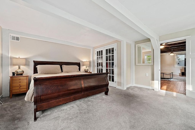 bedroom with baseboards, carpet, and visible vents