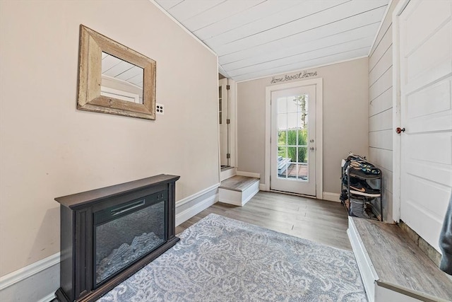 doorway with wooden ceiling and wood finished floors