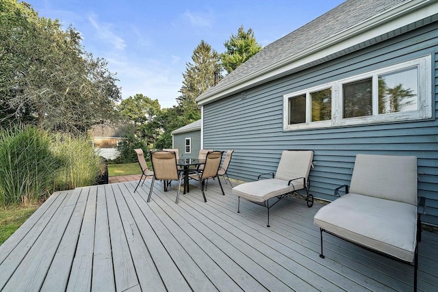 wooden deck with outdoor dining space