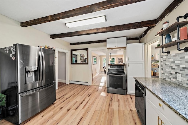 kitchen with stone countertops, baseboard heating, white cabinets, tasteful backsplash, and appliances with stainless steel finishes
