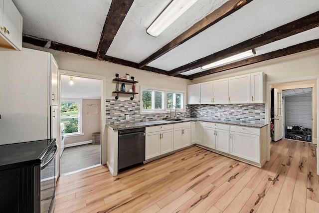 kitchen with a sink, white cabinetry, black dishwasher, and decorative backsplash