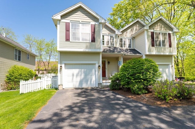 30 Farrwood Pl Unit 30, Haverhill, MA 01835 - view of front of home featuring an attached garage, fence, and driveway
