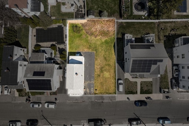 aerial view of property and surrounding area with nearby suburban area