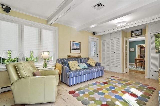 living room with beam ceiling, healthy amount of natural light, and a baseboard radiator