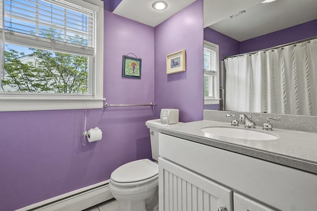 bathroom with a baseboard radiator, toilet, and vanity