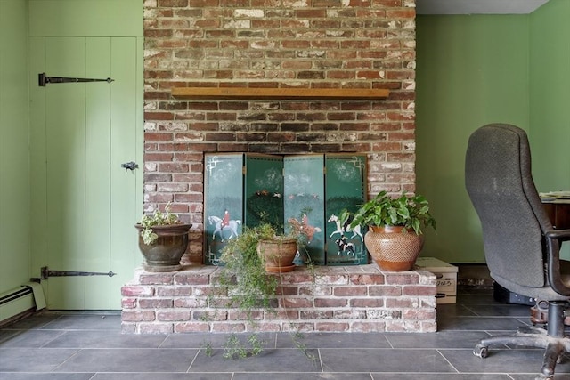 interior details featuring a baseboard heating unit