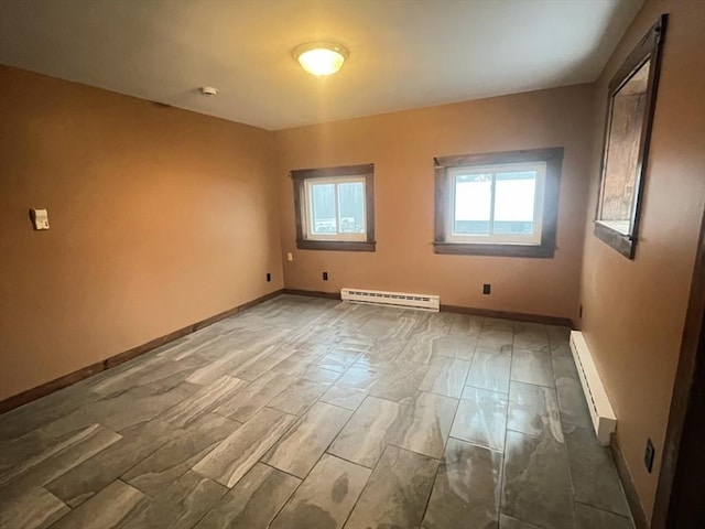 empty room featuring baseboard heating