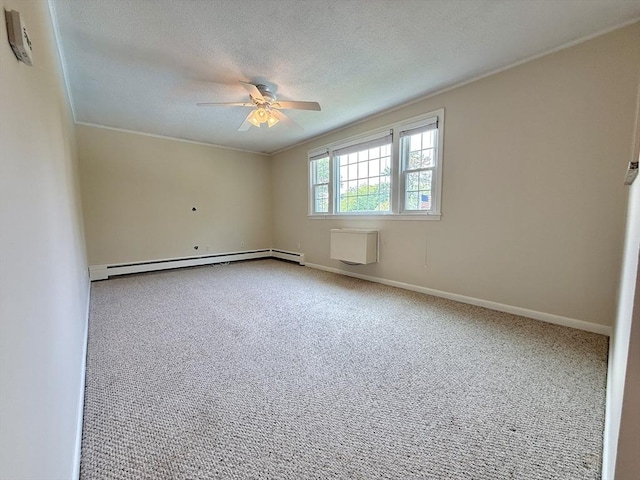 174 Upper County Unit 2-15, Dennis, MA 02639 - empty room with baseboard heating, a ceiling fan, a textured ceiling, carpet, and crown molding