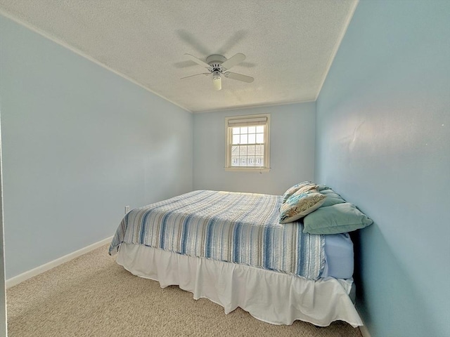 174 Upper County Unit 2-15, Dennis, MA 02639 - carpeted bedroom featuring a textured ceiling, baseboards, and ceiling fan