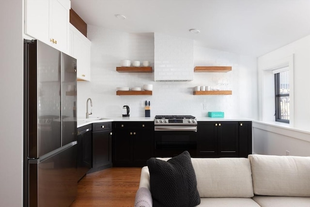 211 W Springfield St, Boston, MA 02118 - kitchen with appliances with stainless steel finishes, dark cabinets, white cabinetry, light countertops, and vaulted ceiling