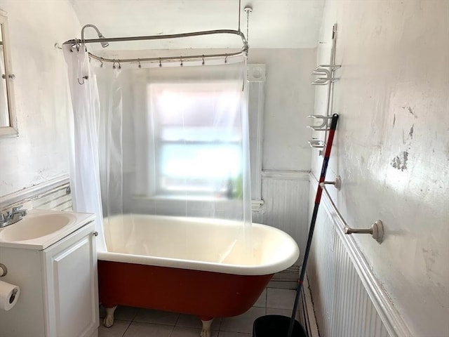 6-8 Imrie Rd, Boston, MA 02134 - bathroom with vanity, wainscoting, tile patterned floors, and shower / bath combo with shower curtain