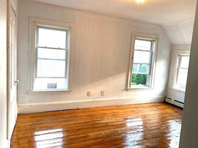 6-8 Imrie Rd, Boston, MA 02134 - unfurnished room featuring a baseboard radiator, hardwood / wood-style floors, lofted ceiling, and plenty of natural light